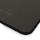 Dark charcoal office desk mat with bronze workspace details for focused professional setups