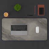 Premium office desk mat with muted bronze accents and soft graphite texture