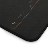 Dark executive office desk mat with subtle bronze details for professional workspaces