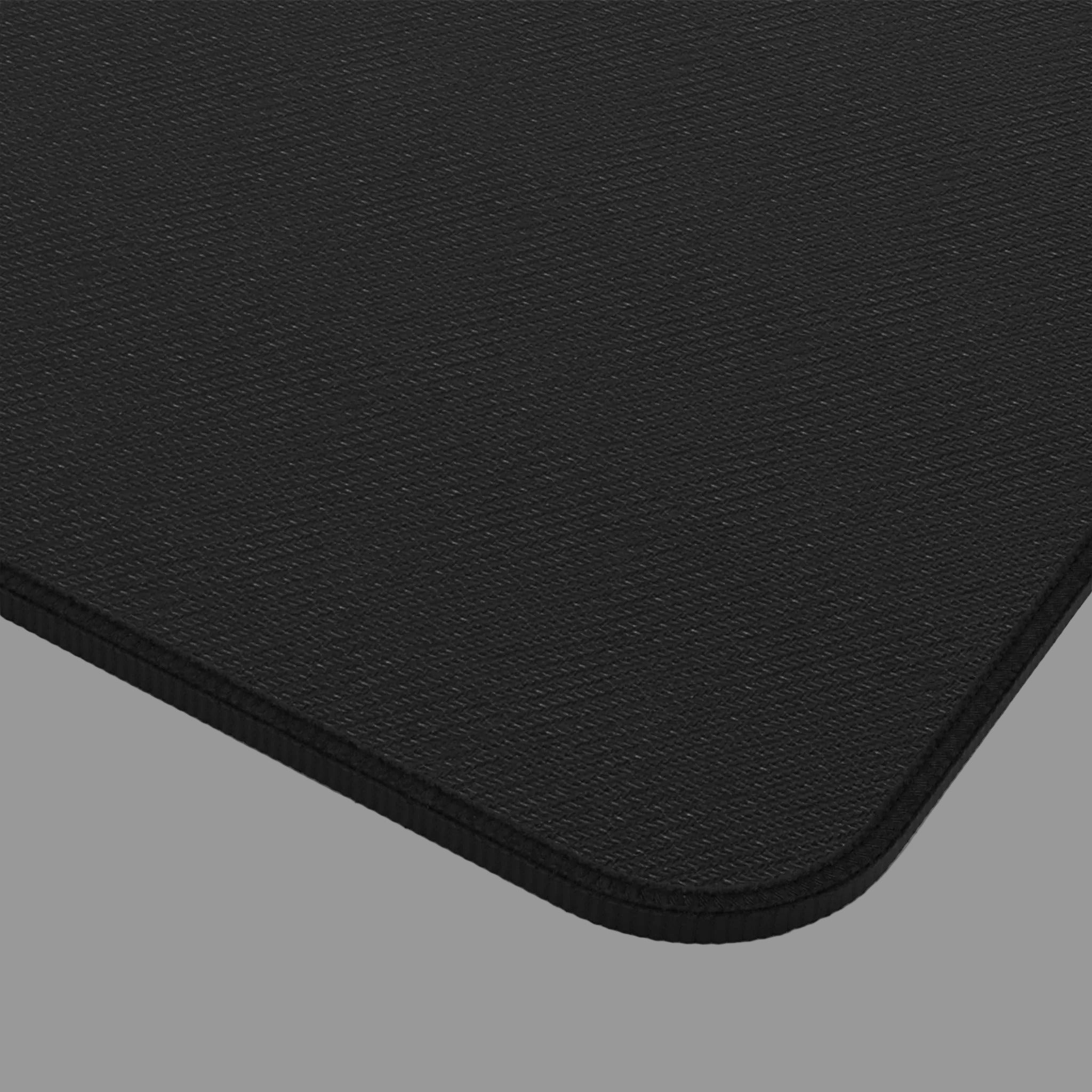 Close-up of a black mouse pad with a textured surface.